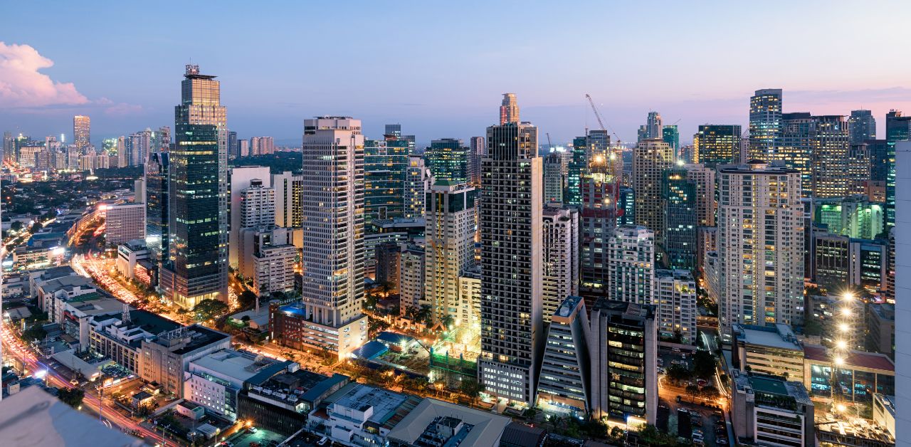 A aerial photo of the Metro Manila skyline at dusk